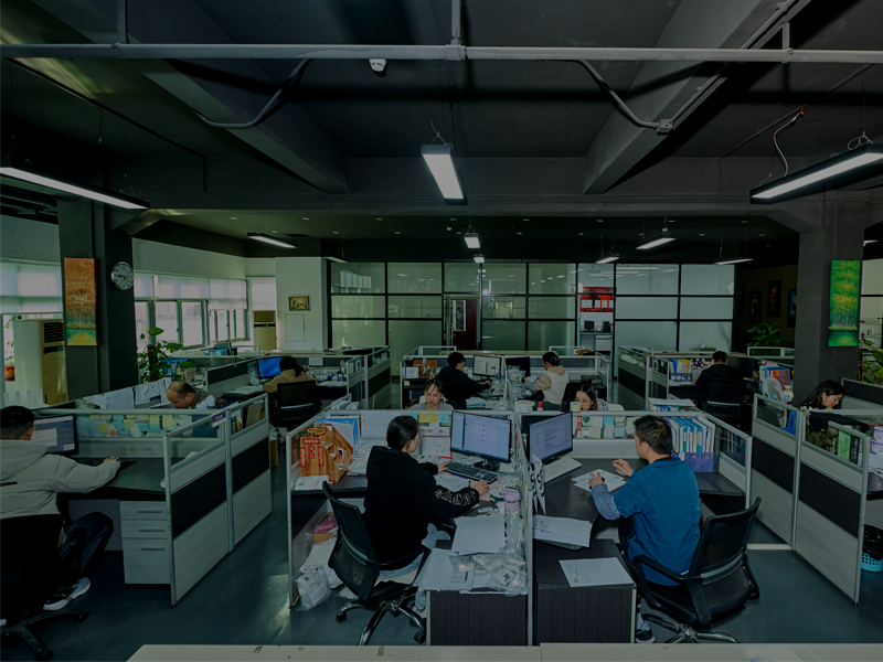 PEPHAWK's office: A modern, open-plan environment where team members are actively engaged at their cubicle workstations. 